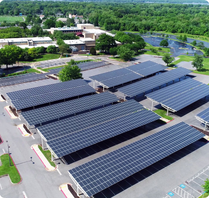 aerial view of solar panels installed in roof of parking