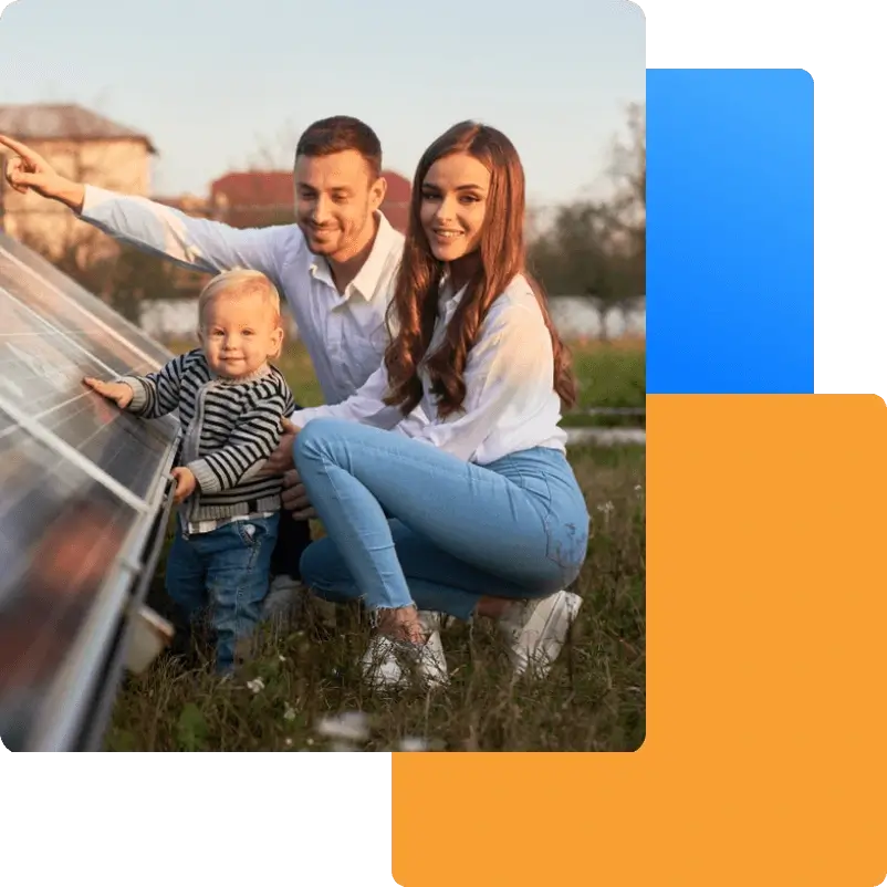 Photo of a Family beside solar panels