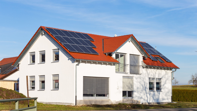 solar panels on a rooftop of a new building in south german countryside